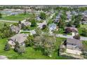 Expansive aerial view of a residential neighborhood with mature trees and well-maintained lawns in a serene setting at 3027 Ash Way, Lapel, IN 46051