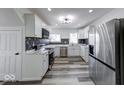 Well-equipped kitchen featuring stainless steel appliances, marble countertops, and modern backsplash at 3132 Indianapolis Ave, Indianapolis, IN 46208
