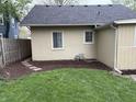 Backyard featuring a well-maintained lawn and a charming stepping stone path at 421 W 44Th St, Indianapolis, IN 46208