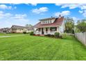 Charming home with landscaped yard, front porch, new roof, and is located on a corner lot at 429 E Main St, Whiteland, IN 46184