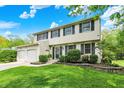 Well-maintained home with a manicured lawn and neatly trimmed shrubs at 5341 Armstrong Dr, Indianapolis, IN 46237