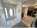 Bright entryway with tiled floors and direct sightlines into the kitchen area at 6231 Oak Limb Ct, Indianapolis, IN 46221