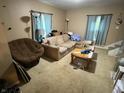Cozy living room featuring carpet, neutral colored walls and a couch at 658 Chestnut St, Noblesville, IN 46060