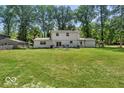 Large, grassy backyard with a deck, perfect for outdoor entertaining and relaxation at 7546 Lindenwood Dr, Indianapolis, IN 46227