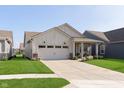 Attractive single-story home with a two-car garage, covered porch, and well-maintained landscaping at 796 Sapp Cir, Westfield, IN 46074