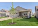 Beautiful single-story home with a two-car garage, covered porch, and mature tree in the front yard at 796 Sapp Cir, Westfield, IN 46074