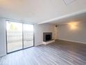 Spacious living room with a fireplace and sliding glass doors to the backyard at 8350 Paso Del Norte Ct, Indianapolis, IN 46227