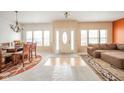 Open-concept living space with a dining area, sofa, ample natural light, and a welcoming foyer at 10090 Eagle Eye Way, Indianapolis, IN 46234