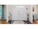 Inviting foyer with a double door entry, decorative rug, and elegant accents at 1101 High Ct, Carmel, IN 46033
