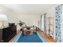 Bright office space with wood floors, stylish curtains, a desk, and ample natural light at 1101 High Ct, Carmel, IN 46033