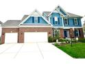 Charming home featuring a three-car garage and beautiful landscaping at 13766 Heatherfield Dr, Fishers, IN 46038