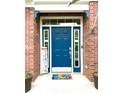 Welcoming blue front door with colorful mat and seasonal decorations at 13766 Heatherfield Dr, Fishers, IN 46038
