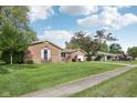 Well-kept single-story brick house on a green lawn, located in a quiet residential area at 1416 Wellington Ave, Indianapolis, IN 46219