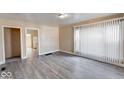 Open-concept living space featuring durable new flooring and neutral paint at 1425 S Belmont Ave, Indianapolis, IN 46221