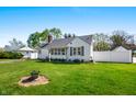 Beautiful home exterior with a well-manicured lawn, showcasing the peaceful backyard and neighborhood at 335 N Franklin Rd, Indianapolis, IN 46219