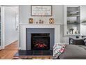 Close-up of the fireplace with decorative mantel, flanked by stylish shelves and decor at 335 N Franklin Rd, Indianapolis, IN 46219