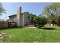 Spacious backyard with hot tub, playset, mature trees and a wooden privacy fence at 4257 Locust Ln, Brownsburg, IN 46112