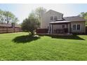 Expansive backyard featuring a gazebo with outdoor seating, a hot tub, and ample lawn space at 4257 Locust Ln, Brownsburg, IN 46112