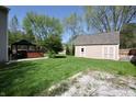 Large backyard with a gazebo covered hot tub, storage shed, and plenty of green space at 4257 Locust Ln, Brownsburg, IN 46112