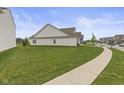 A well maintained yard surrounds this charming single story home in this suburban neighborhood at 5423 Maywood Dr, Whitestown, IN 46075