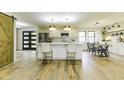 Bright and spacious kitchen featuring a large island, stainless steel appliances, and modern finishes at 5707 S Burlington Dr, Muncie, IN 47302