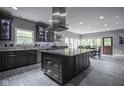 Modern kitchen featuring a large island, stainless steel appliances, and stylish cabinetry at 5925 Silas Moffitt Way, Carmel, IN 46033