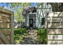 Street view of a charming home's exterior with landscaped walkway leading to the front door at 629 N Keystone Ave, Indianapolis, IN 46201