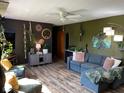Cozy living room with stylish decor, comfortable seating, and a warm, inviting ambiance at 630 Johnson Rd, Mooresville, IN 46158