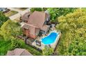 Aerial view of home with pool, pergola, patio, and fenced yard at 676 La Placita St, Greenwood, IN 46143