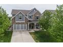 Beautiful exterior elevation of this two-story home with a two car garage at 755 Canberra Blvd, Westfield, IN 46074
