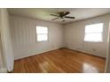 Empty bedroom with hardwood floors, ceiling fan and lots of natural light at 7629 Walton Dr, Indianapolis, IN 46214