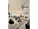 Spacious living room with modern furniture, stylish decor, ceiling fan, and ample natural light at 1205 N Gibson Ave, Indianapolis, IN 46219