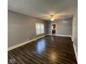Bright living room features new flooring and fresh paint creating an inviting atmosphere at 1401 W 34Th St, Indianapolis, IN 46208