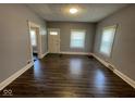 The spacious living room features new flooring, fresh paint, and ample natural light at 1401 W 34Th St, Indianapolis, IN 46208