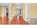 Inviting foyer showcasing hardwood floors, neutral paint, and an open layout connecting to other rooms at 15329 Smithfield Dr, Westfield, IN 46074