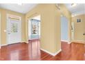 Open foyer featuring hardwood floors and a view into a sunroom at 15329 Smithfield Dr, Westfield, IN 46074