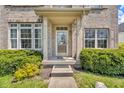 Close-up of the home's entrance, highlighting the decorative glass door and manicured landscaping at 15329 Smithfield Dr, Westfield, IN 46074