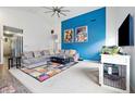Spacious living room with modern decor, plush carpeting, a large sectional and lots of light at 1666 Huntzinger Blvd, Pendleton, IN 46064