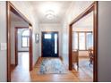 Inviting entryway featuring hardwood floors, a stylish light fixture, and access to multiple rooms at 1893 Water Oak Way, Avon, IN 46123