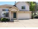 Charming two-story home with a two car garage, front porch, neutral siding, and a well maintained driveway at 2277 Grand Fir Dr, Greenwood, IN 46143