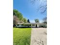 Charming house featuring well-maintained lawn and a spacious driveway leading to an attached garage at 2871 N Talley Rd, Columbus, IN 47203