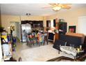 Spacious living area with tile flooring, kitchen, and stainless steel appliances at 321 Harlan St, Indianapolis, IN 46201