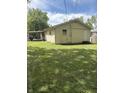 Back exterior of home has new door and a large backyard at 346 Gimber Ct, Indianapolis, IN 46225