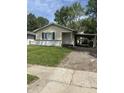 Cozy single-story home features a carport and a well-maintained front lawn at 346 Gimber Ct, Indianapolis, IN 46225