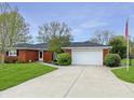 Attractive brick home with a well-maintained lawn, long driveway, and a two-car garage at 3710 E 750 S, Lebanon, IN 46052