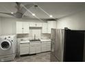 Bright kitchen with white cabinetry, stainless steel appliances, and modern fixtures at 4456 N Kenyon Dr, Indianapolis, IN 46226