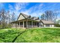 Beautiful home with a large porch and a detached garage, set on a spacious lot at 5386 W 1100 N, Fountaintown, IN 46130