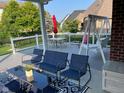 Inviting covered deck area with comfortable seating, ideal for relaxation and enjoying outdoor living at 5601 Harness Dr, Greenwood, IN 46143