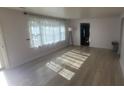 Bright living room with wood floors and a large window at 5831 Aho Dr, Avon, IN 46123