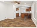 Open floor plan with hardwood floors and a modern kitchen in the background at 600 S Vine St, Muncie, IN 47302